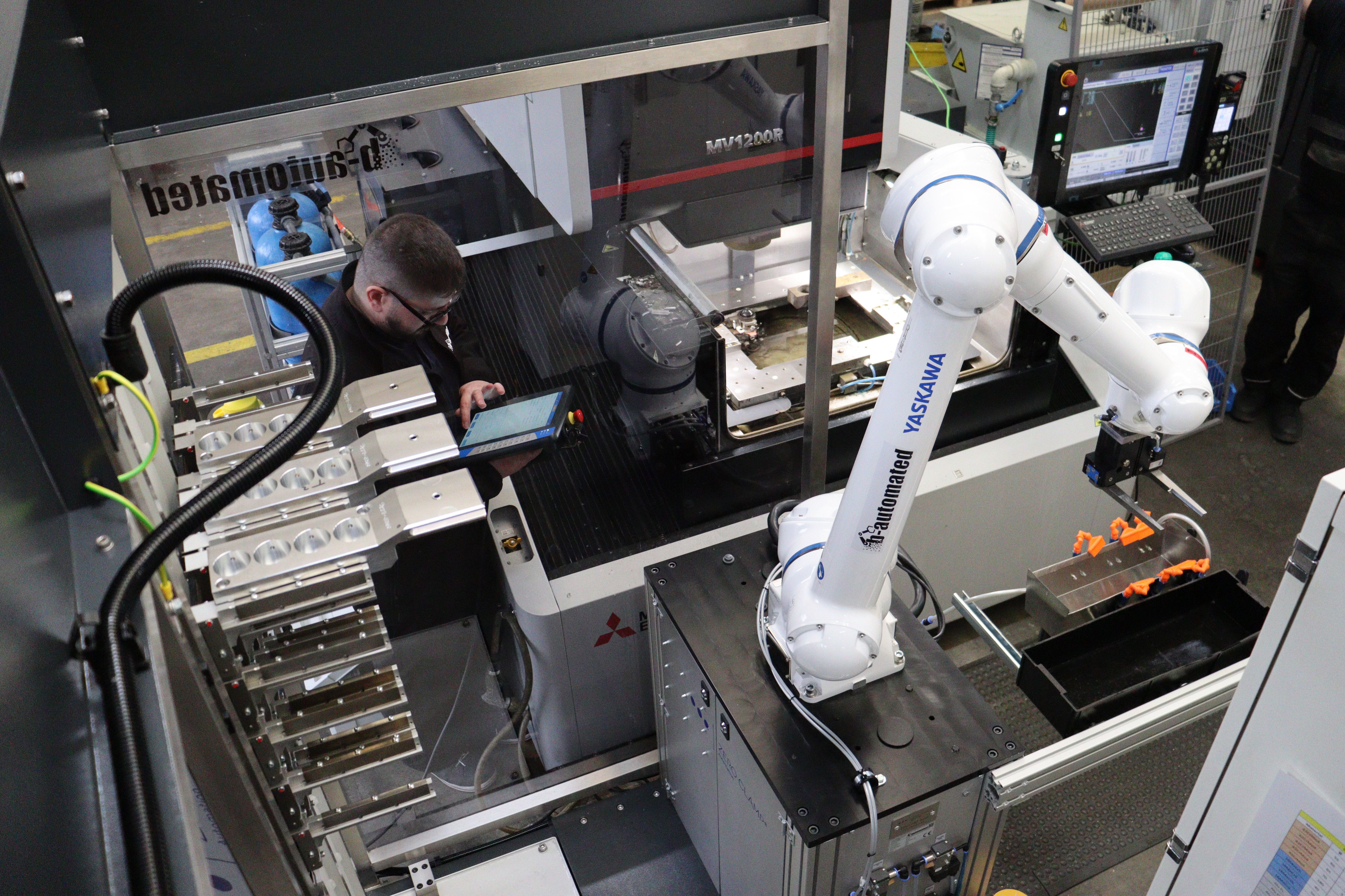 System integrator b-automated automates erosion machine with cobot from ...